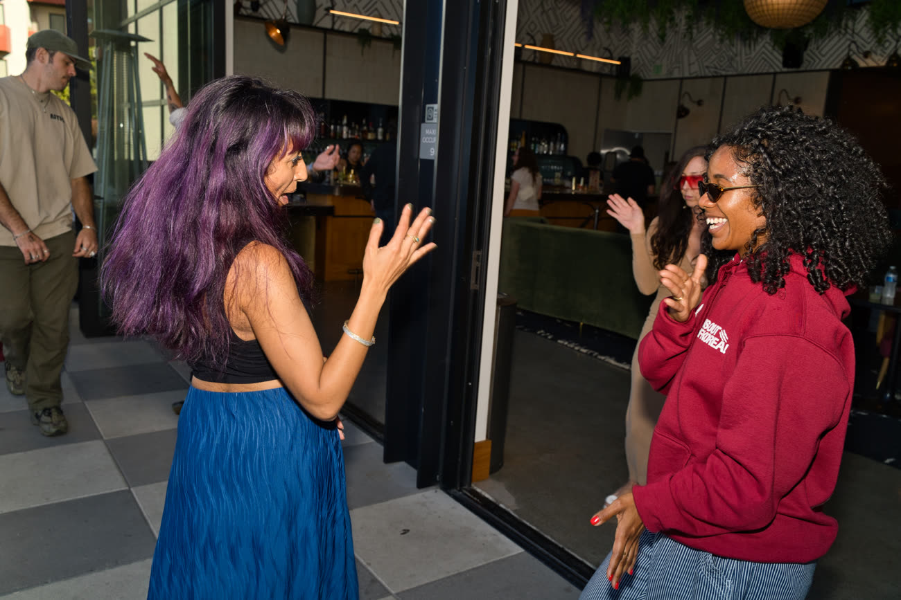 Friends laughing mid-dance